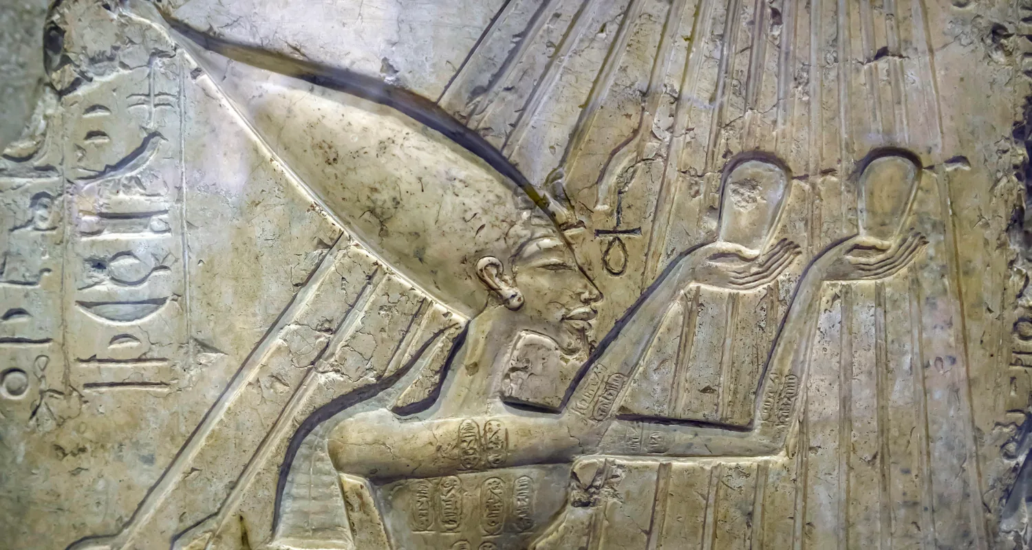 Pharaoh Akhenaten worshiping for god Atenu